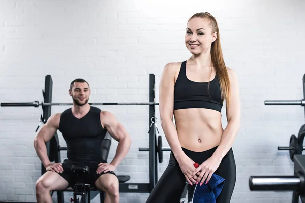 Man and woman in gym — Stock Photo, Image