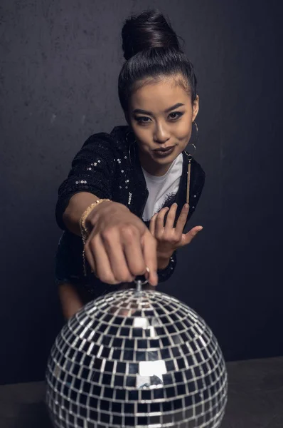 Glamour asian girl with disco ball — Stock Photo, Image