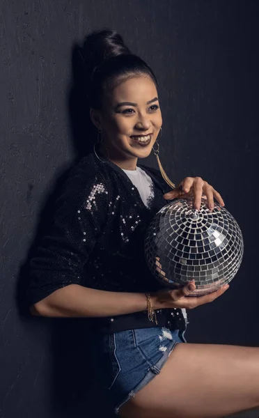 Glamour asian girl with disco ball — Stock Photo, Image