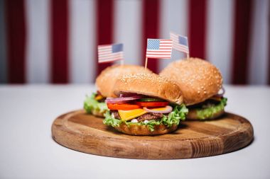 cheeseburgers with little american flags clipart