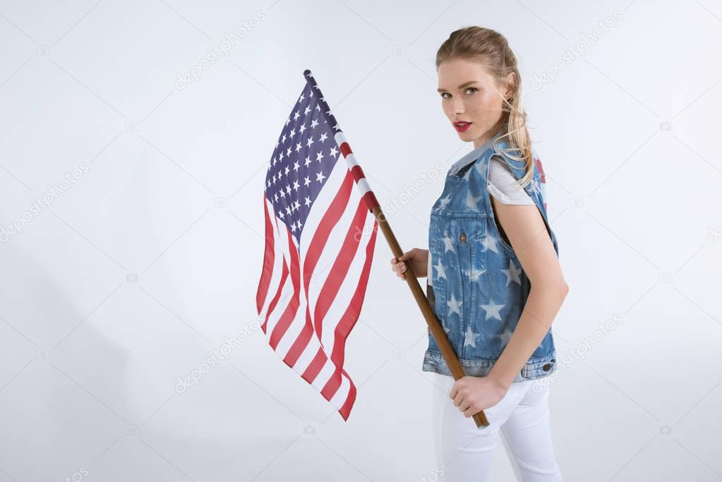 caucasian girl waving USA flag