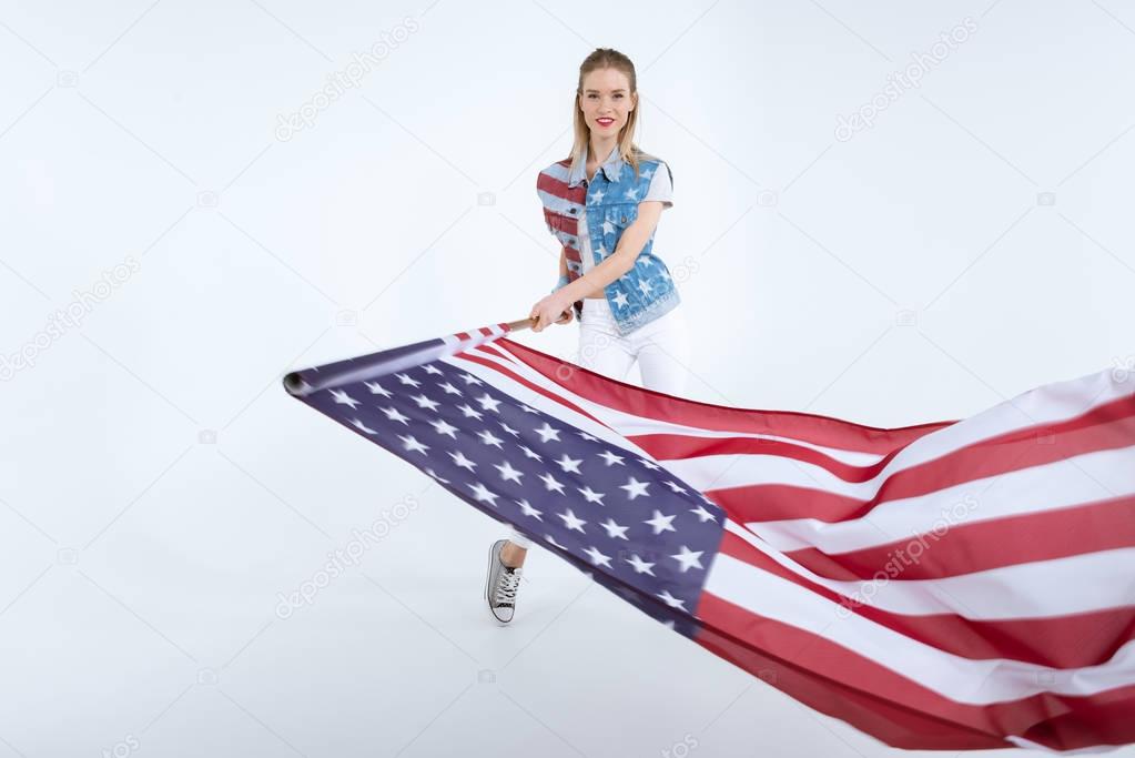 happy girl waving USA flag