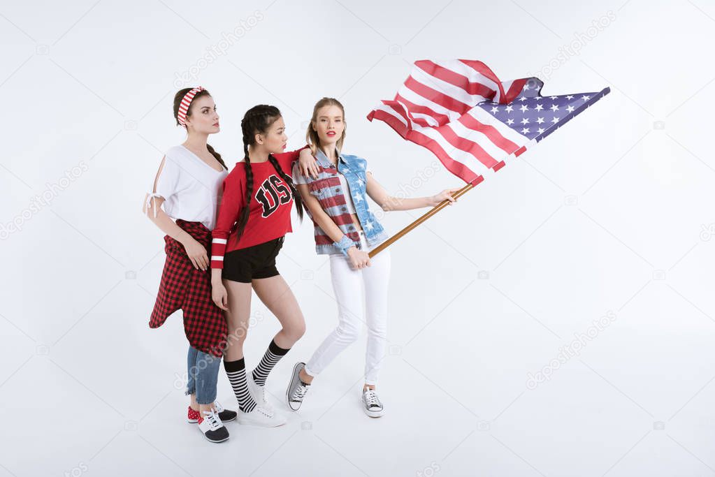 girls posing with american flag