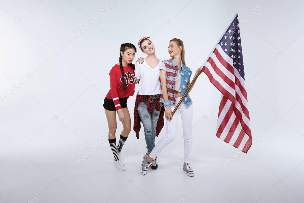 women standing with American flag