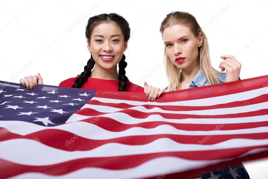multiethnic women holding flag of USA
