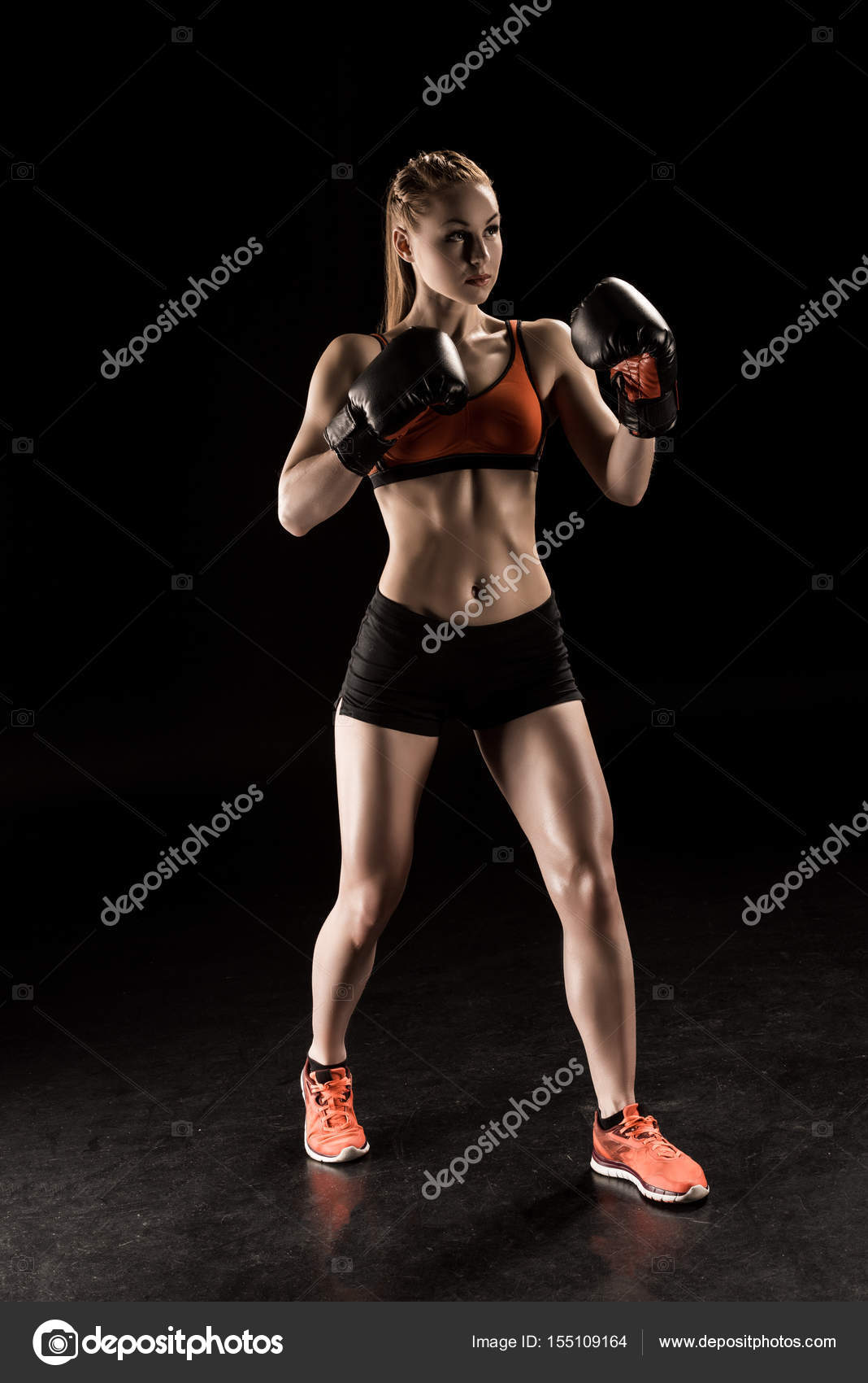 Sportswoman in boxing gloves — Stock Photo © NatashaFedorova