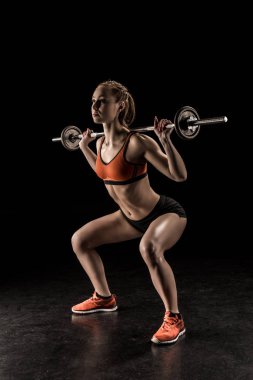 Sportswoman training with barbell  clipart