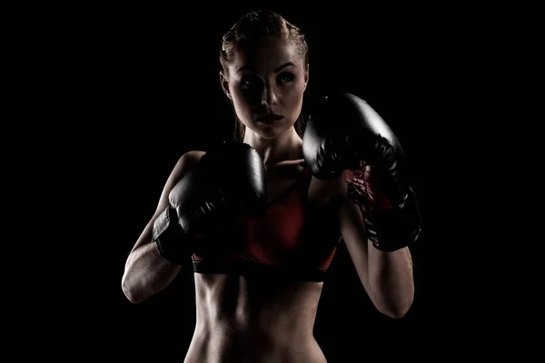 Sportswoman exercising in boxing gloves — Stock Photo, Image