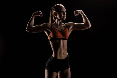 young caucasian sportswoman flexing biceps clipart