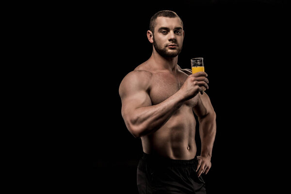 sportive man with glass of juice