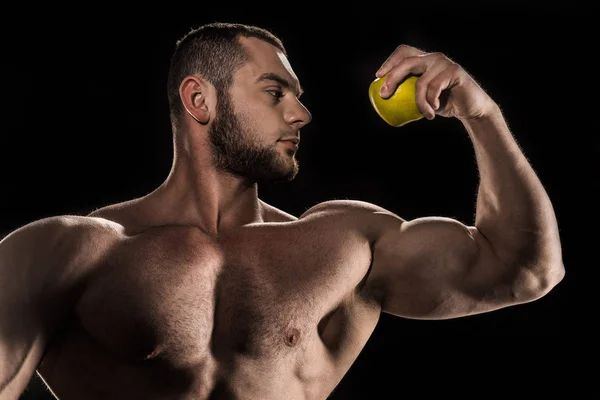 Atleta sem camisa segurando maçã — Fotografia de Stock