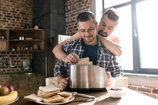 Gay couple having breakfast 