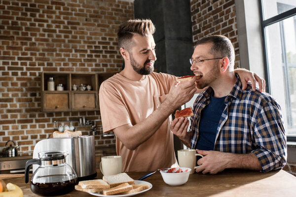 Gay couple having breakfast 