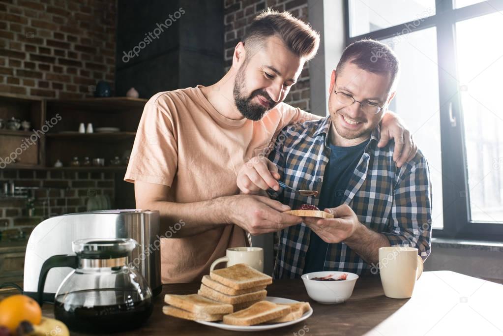 Gay couple having breakfast 