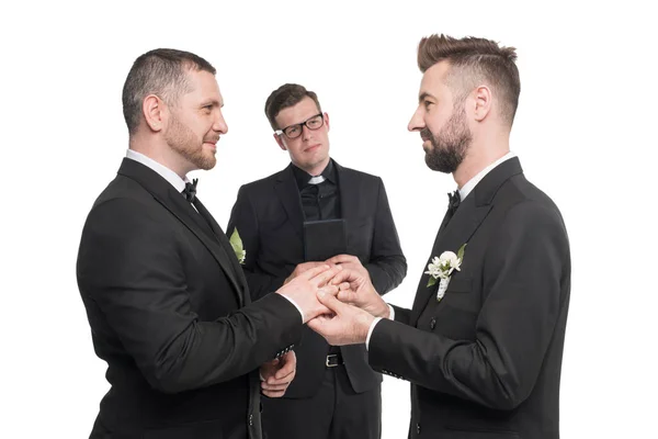 Homosexual couple exchanging rings at wedding — Stock Photo, Image