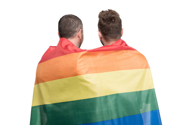 homosexual couple covered by lgbt flag