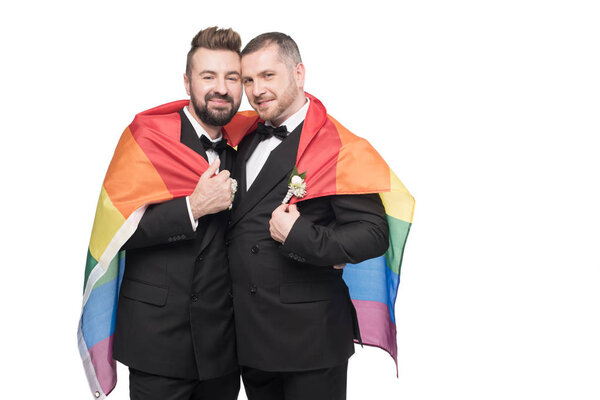 homosexual wedding couple with lgbt flag
