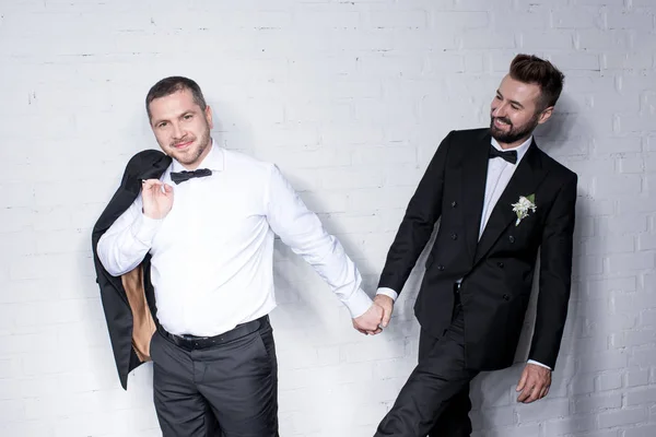 Couple of grooms holding hands — Stock Photo, Image