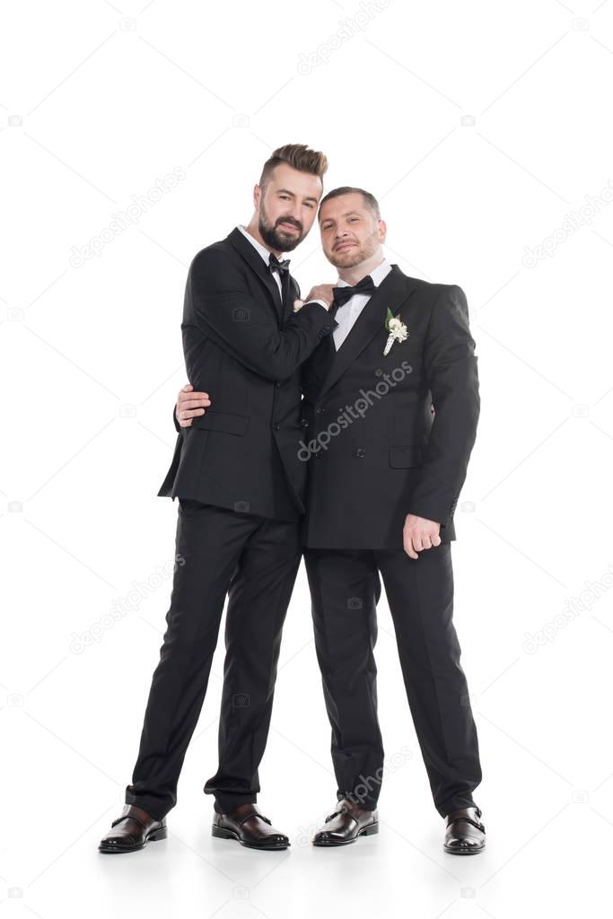 couple of grooms in tuxedos