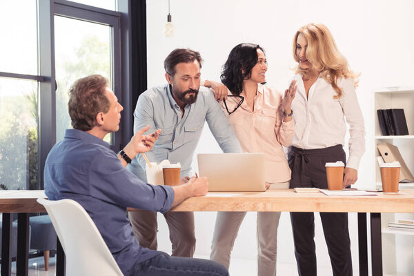 Colleagues using laptop 