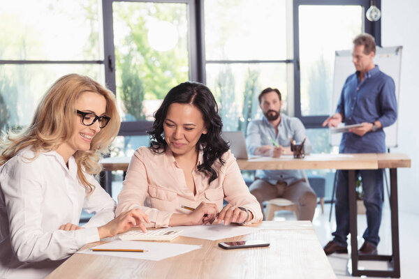 Smiling businesswomen in office 