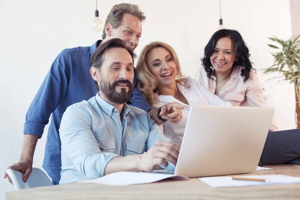 Colleagues using laptop 