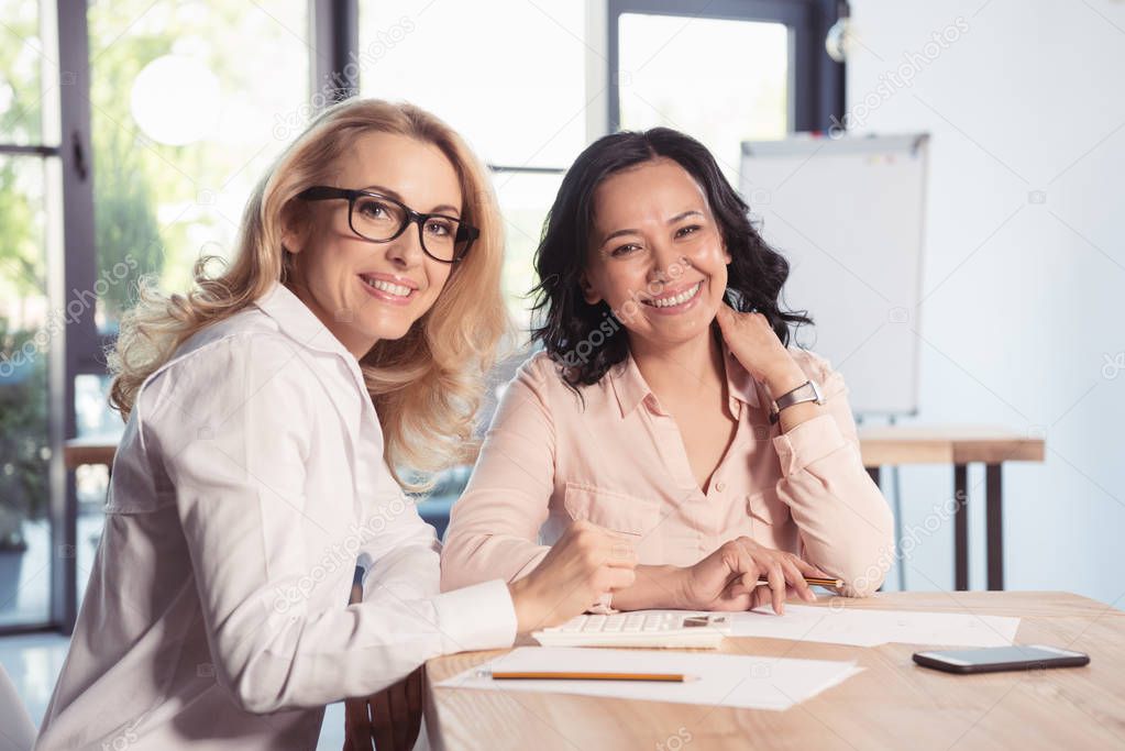 Smiling businesswomen in office 