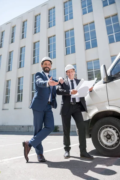 Contractors in formal wear looking at camera — Free Stock Photo