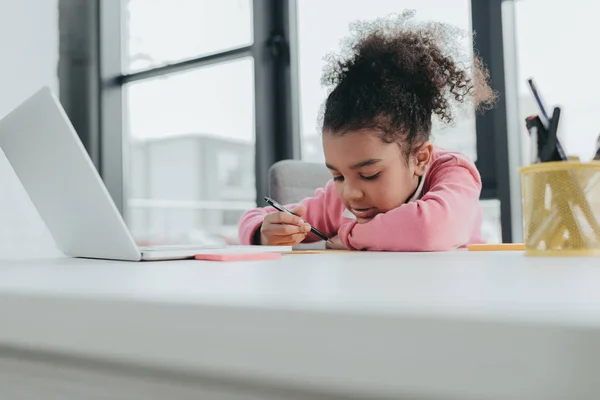 Little girl at office table — Stock Photo, Image