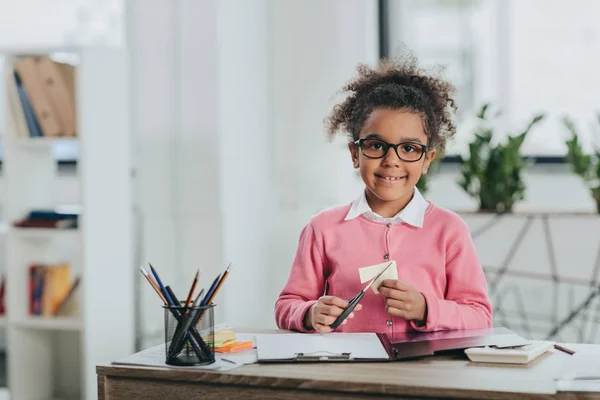 Cute little girl with scissors — Stock Photo, Image