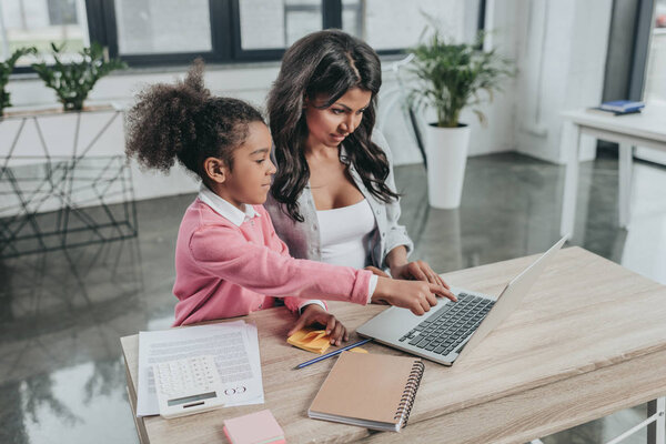 businesswoman typing on laptop