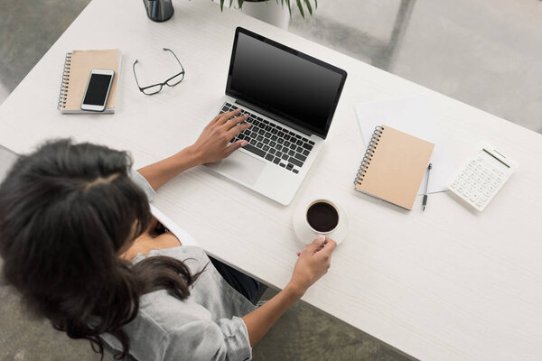 businesswoman working on laptop at office