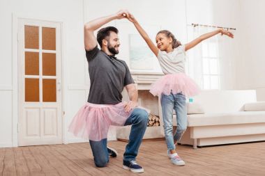 family dancing at home clipart