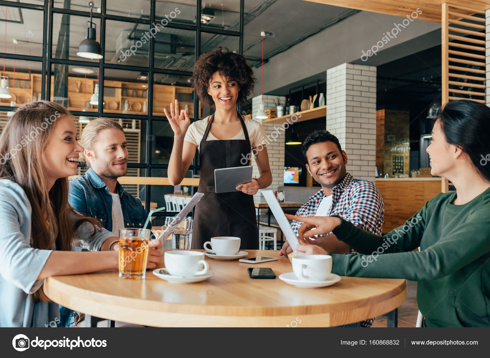 Waitress taking orders from clients — Stock Photo © NatashaFedorova #160868832 Waitress taking orders from clients