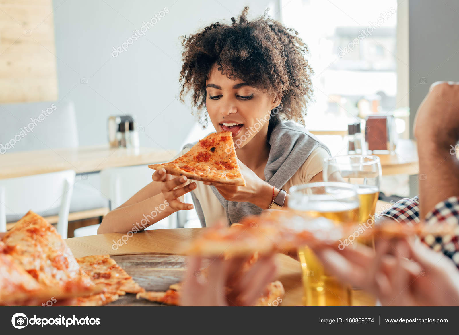 Woman Eating Pizza In Cafe Stock Photo C Natashafedorova 160869074