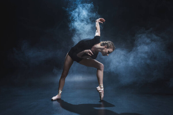 ballerina dancing in pointe and leotard