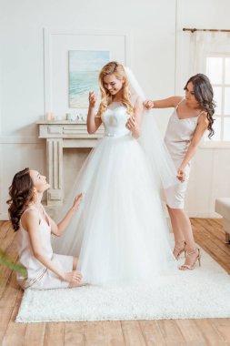 bride with bridesmaids preparing for ceremony clipart