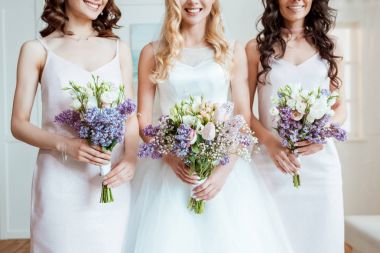 bride with bridesmaids holding bouquets clipart