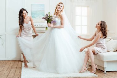 bride with bridesmaids preparing for ceremony clipart