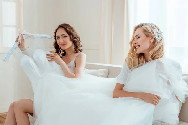 Happy women with wedding dress — Stock Photo, Image