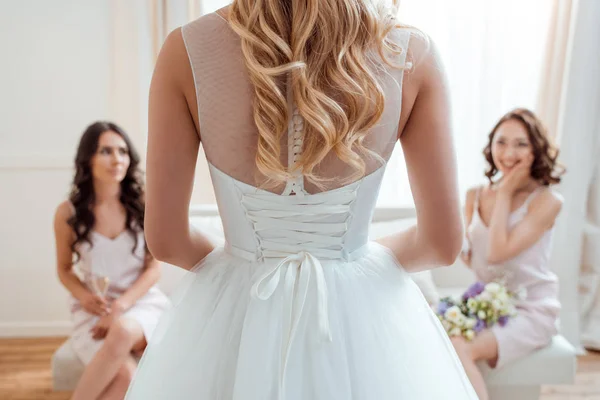 Excited bridesmaids looking at bride — Stock Photo, Image