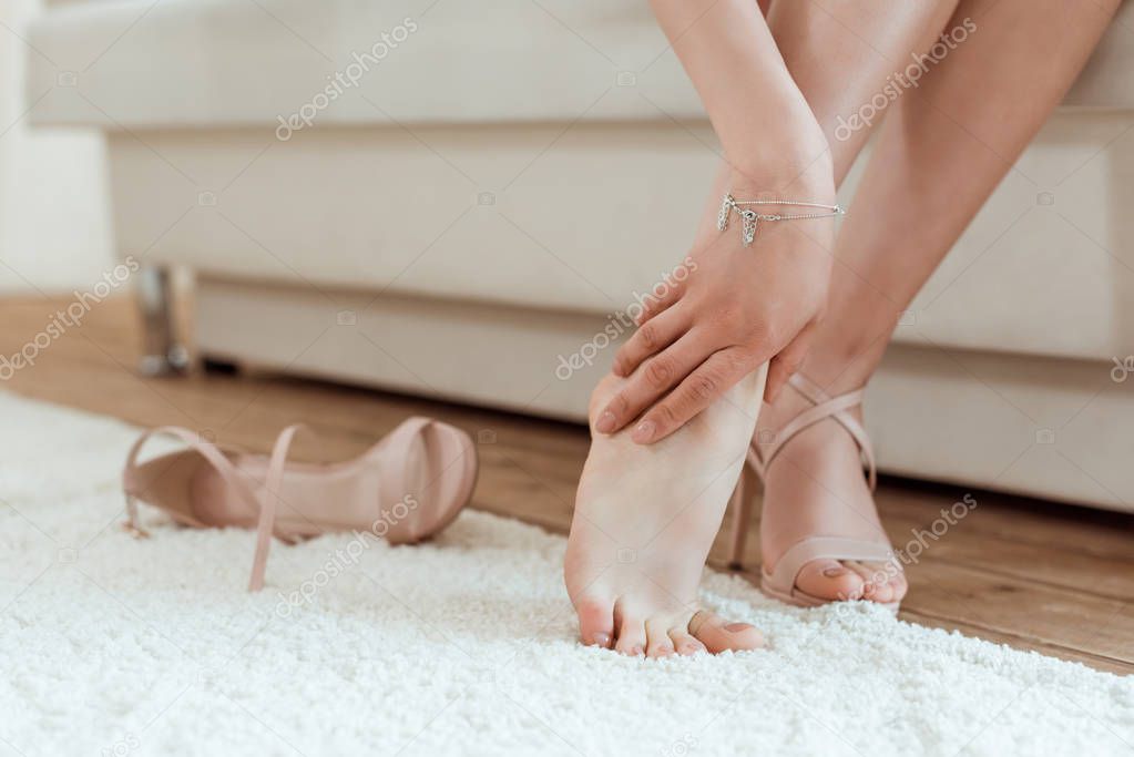 woman taking shoes off