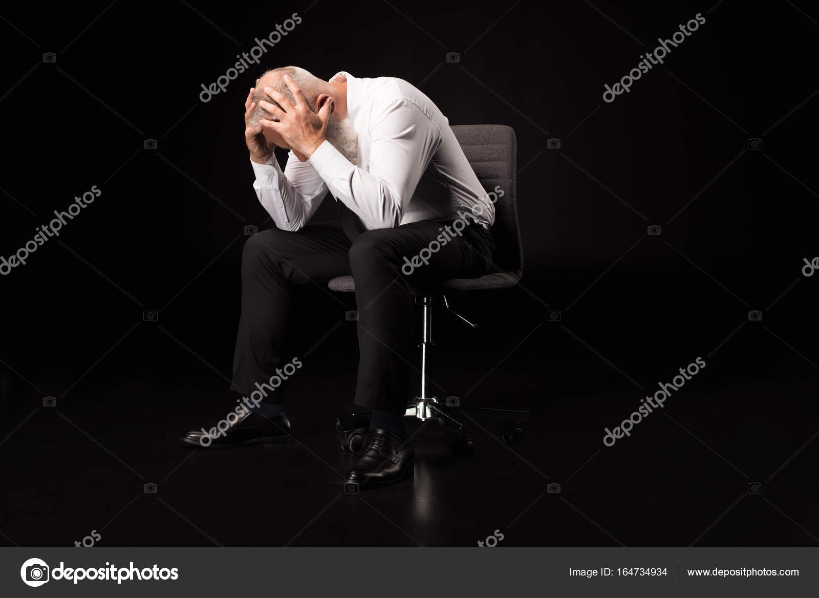 Man holding head in hands — Stock Photo © NatashaFedorova #164734934