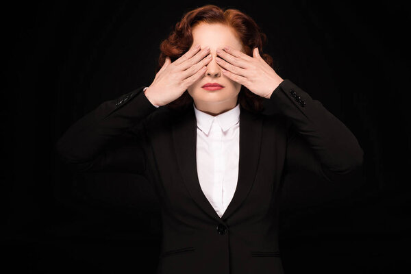 Businesswoman covering eyes