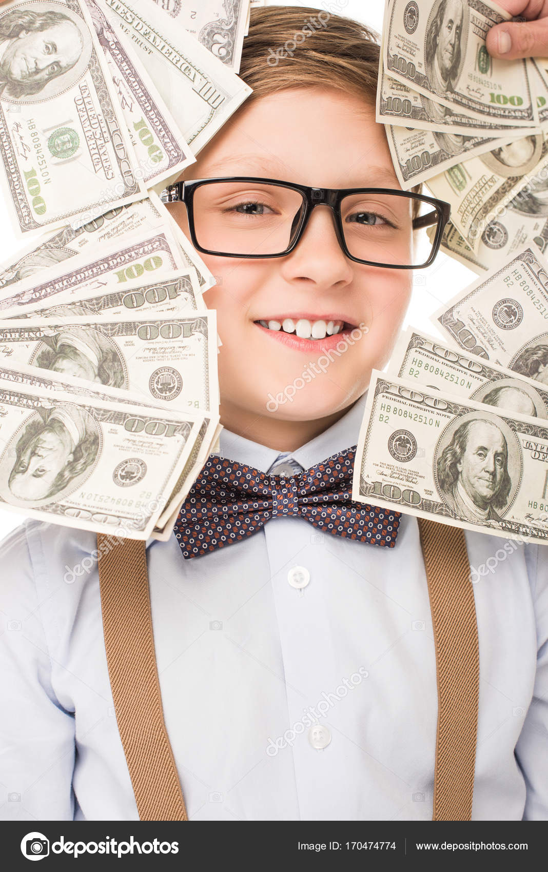 Little boy with dollar banknotes Stock Photo by ©NatashaFedorova 170474774
