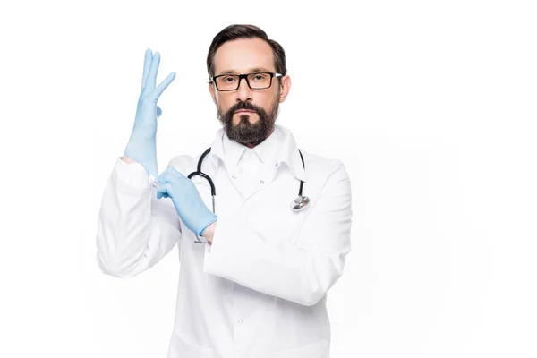 Doctor wearing medical gloves — Stock Photo, Image