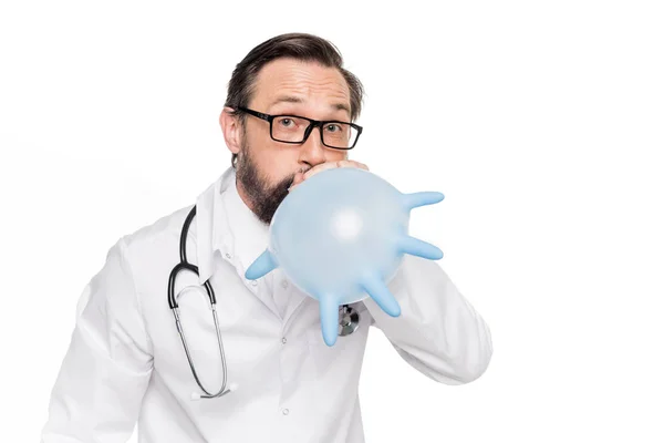 Doctor blowing medical glove — Stock Photo, Image