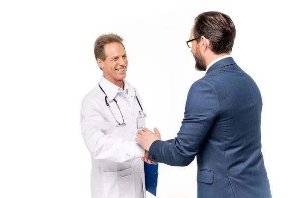 Businessman and doctor shaking hands — Stock Photo, Image