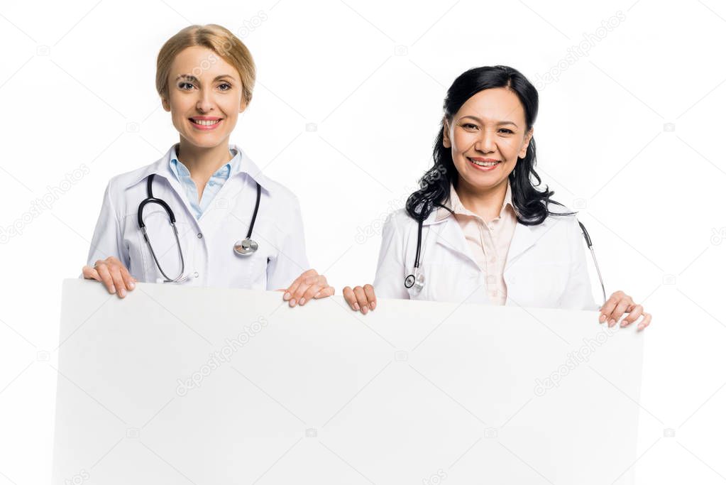 doctors holding blank banner
