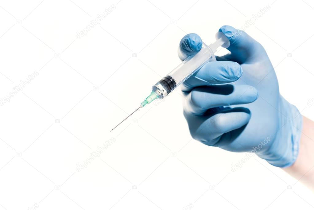 doctor holding syringe